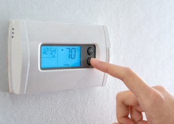 A thermostat set to Fahrenheit for an air conditioner